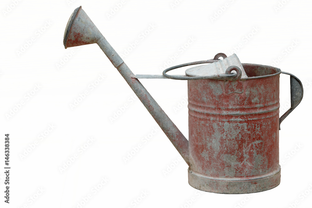 Isolated an old and rusty watering can Isolated an old and rusty watering can