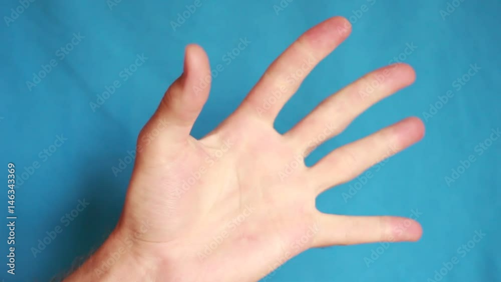 Squeezing and unclenching fingers Squeezing and unclenching fingers
