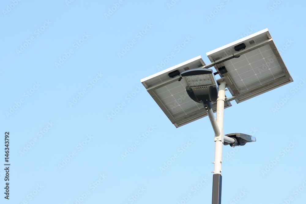 Street lamp post with solar panel energy (against blue sky background) Street lamp post with solar panel energy (against blue sky background)