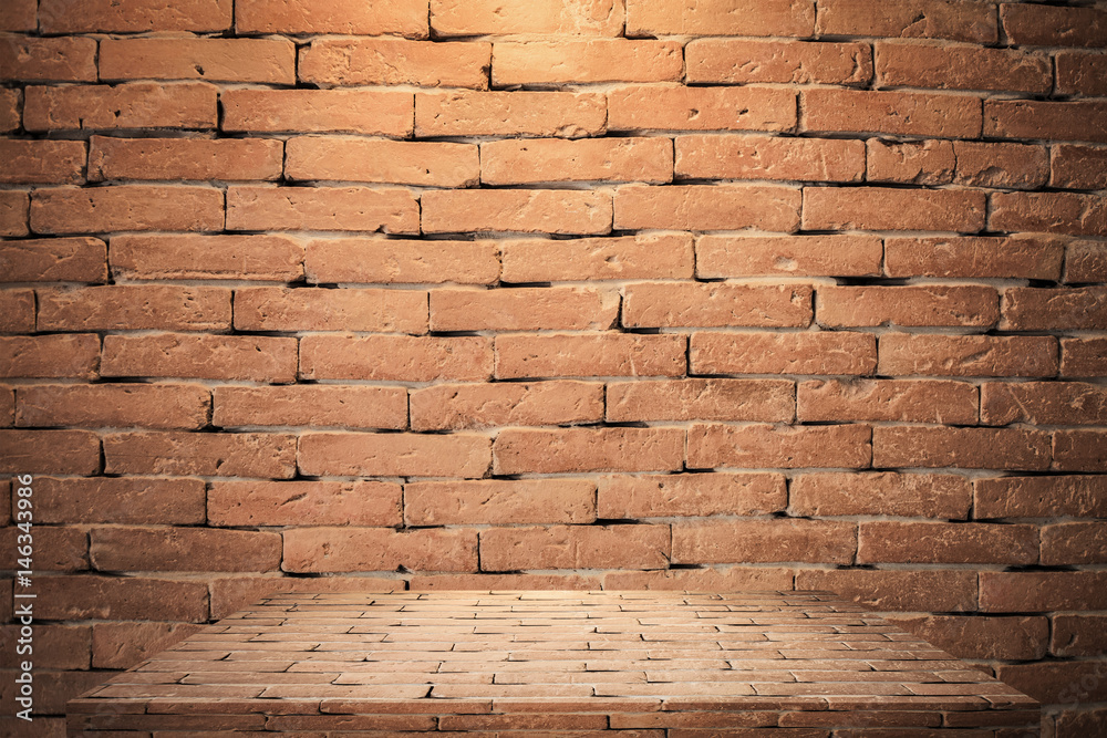 Obraz premium Wood table top with brick background 