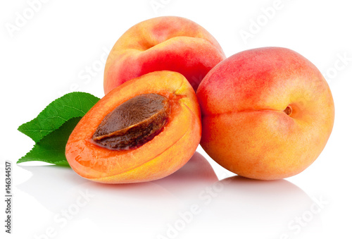 Fresh cut apricot fruits with leaf isolated on white background
