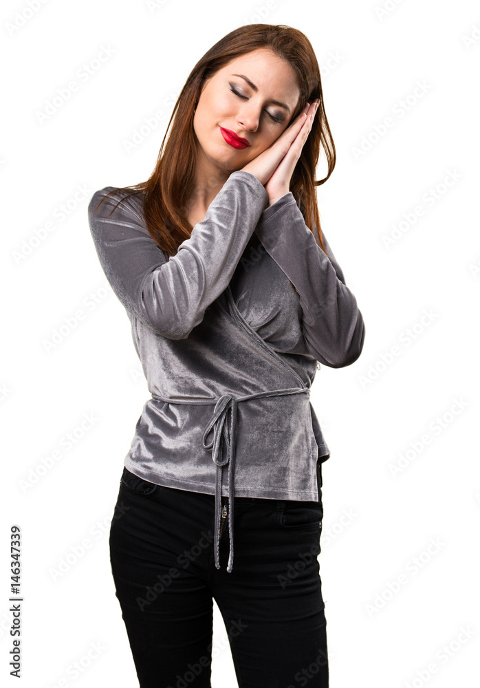 Beautiful young girl making sleep gesture Beautiful young girl making sleep gesture