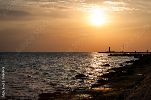 View of a rocky coast beach in the morning. © Martins Vanags