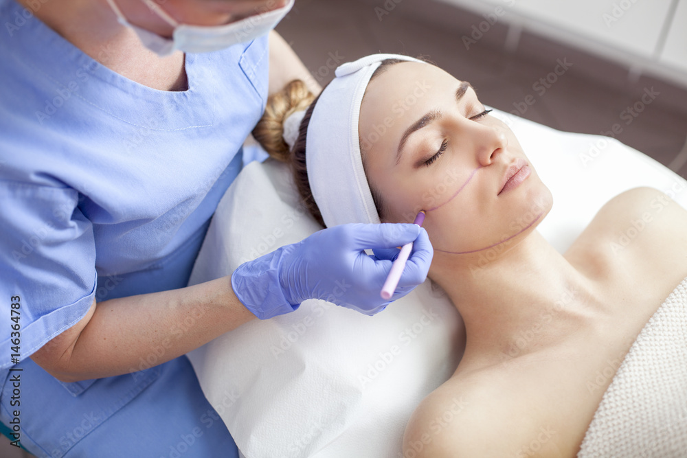 Young beautiful woman in the beauty salon on the face treatment Young beautiful woman in the beauty salon on the face treatment