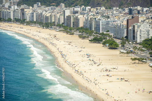 Scenic view of Copacabana Beach with the Rio de Janeiro, Brazil city skyline © lazyllama
