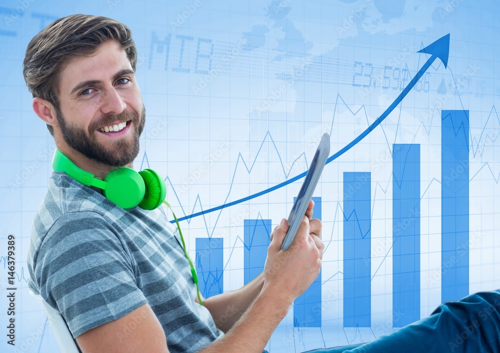 Man leaning back in chair with tablet against blue graph Man leaning back in chair with tablet against blue graph