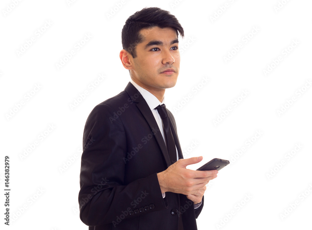 Young man in suit talking on the phone Young man in suit talking on the phone
