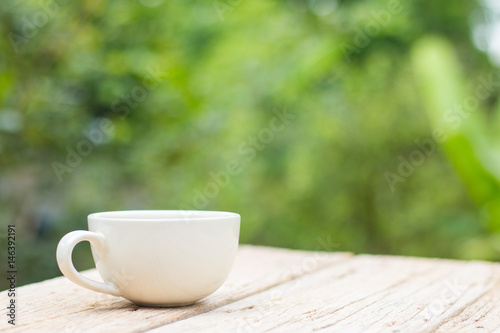 A cup of coffee on a wooden