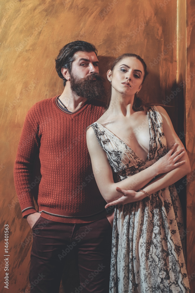 Pretty girl and serious bearded man with beard Pretty girl and serious bearded man with beard