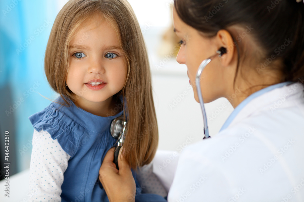 Doctor examining a little girl by stethoscope Doctor examining a little girl by stethoscope