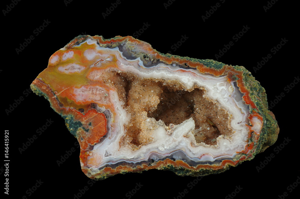 A cross section of the agate stone with quartz geode.  Inside geode is a 
