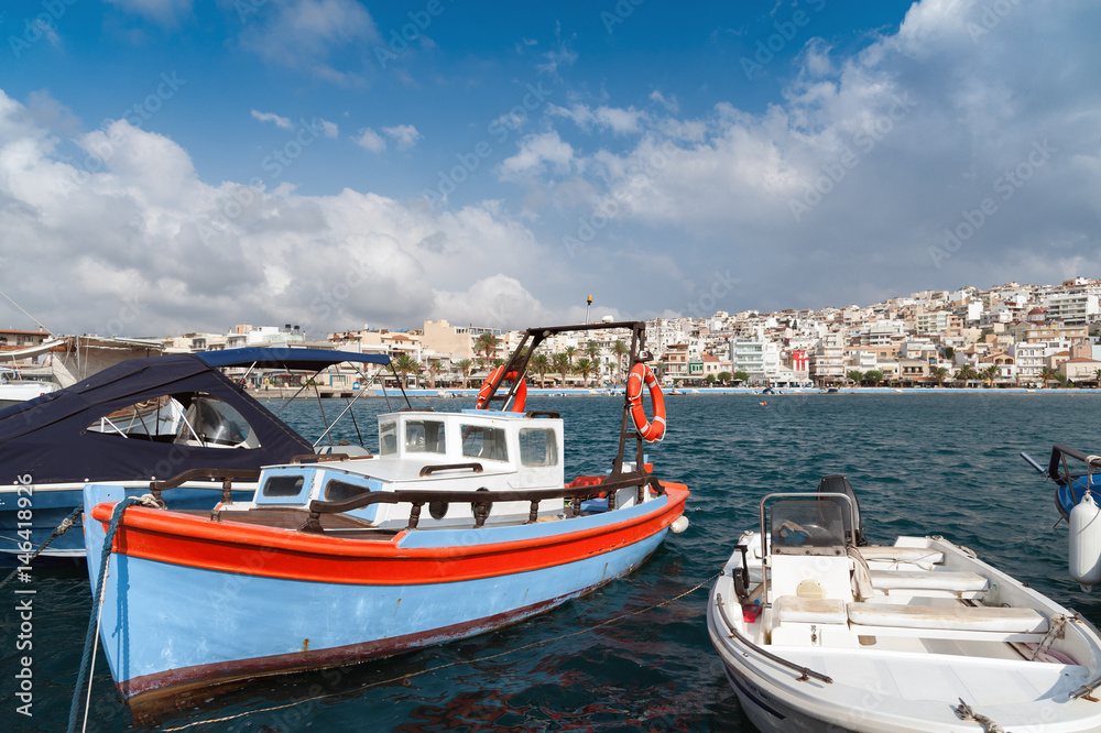 Traditional Greek wooden fishing boat at port of Sitia town in eastern part of Crete island, Greece