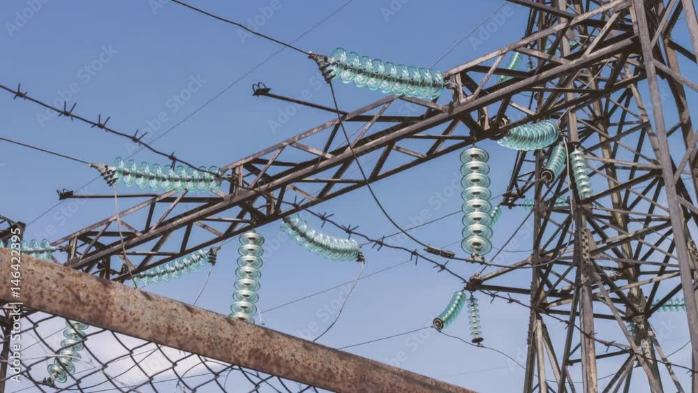 Industrial highvoltage power transformer at a power plant. Supports of