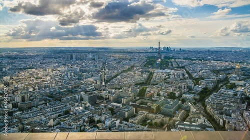 Aerial view of Paris, clouds flying in sky, busy traffic in streets, time-lapse photo