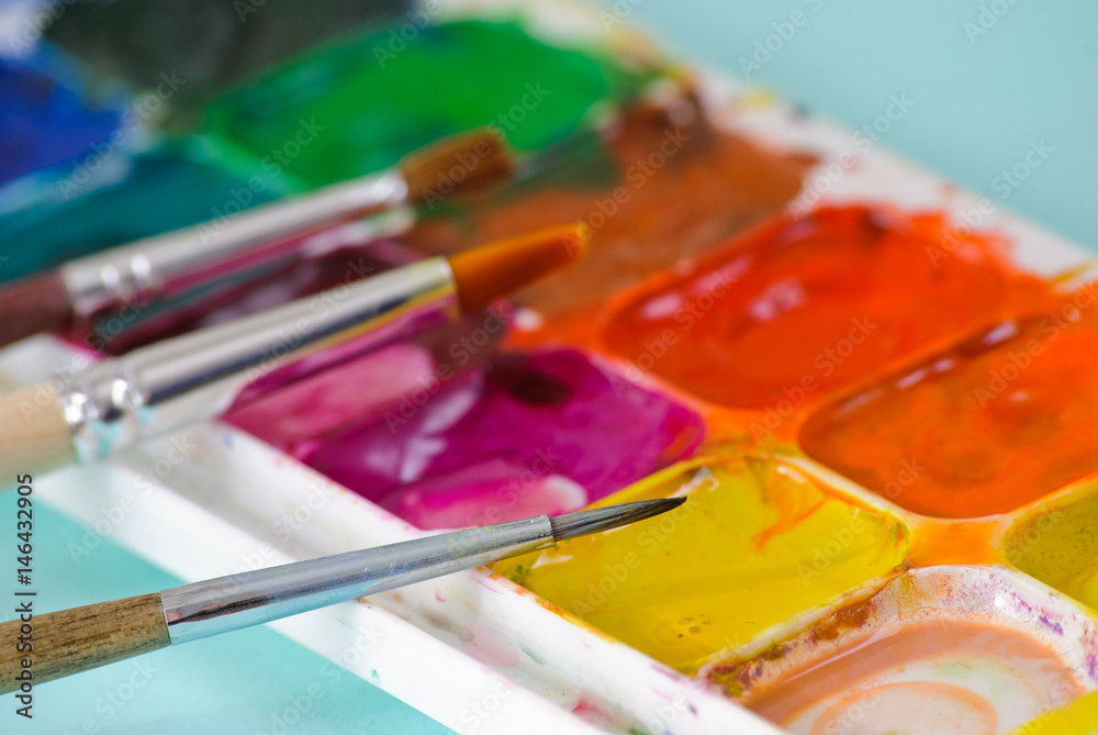 Artist brushes and used palette Artist brushes and used palette