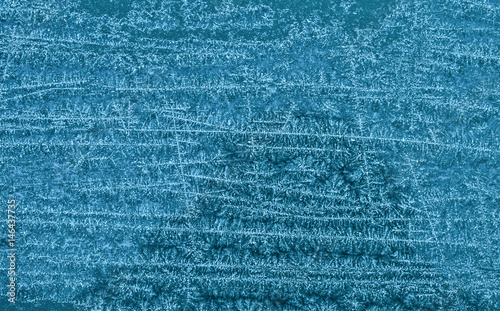 Obraz na płótnie Frozen snowy surface in blue w salonie