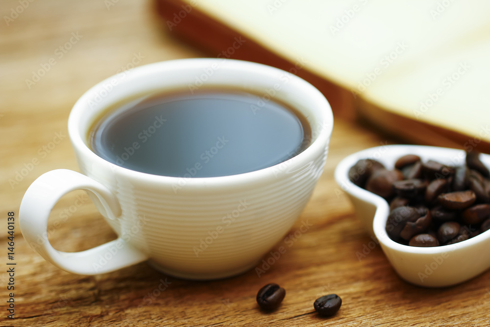 Stock Photo - Coffee cup & book on wood table - vintage (retro) style color effect with soft focus Stock Photo - Coffee cup & book on wood table - vintage (retro) style color effect with soft focus