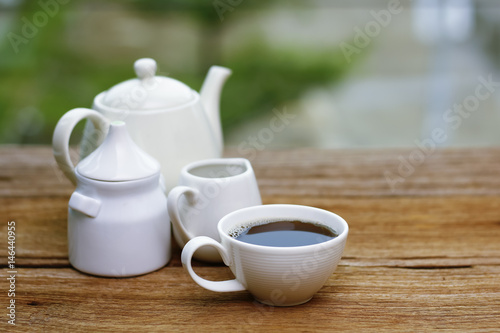 Stock Photo - cups of coffee and milk on woodden table