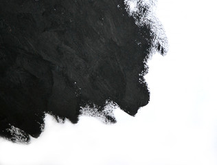 black brush strokes oil paints on white paper. Isolated on white background. Abstract creative background