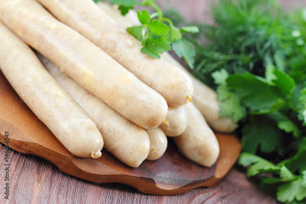 Raw chicken sausages prepared for frying Raw chicken sausages prepared for frying