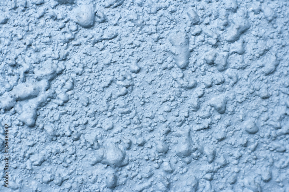 Background wall with a plaster texture, painted in blue