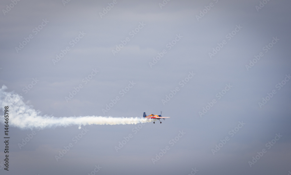 Fototapeta premium Airplane and smoke in a show