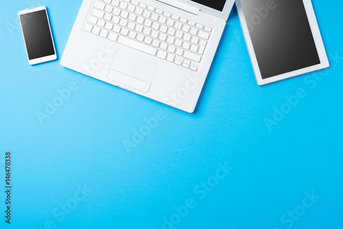 Digital devices on blue background