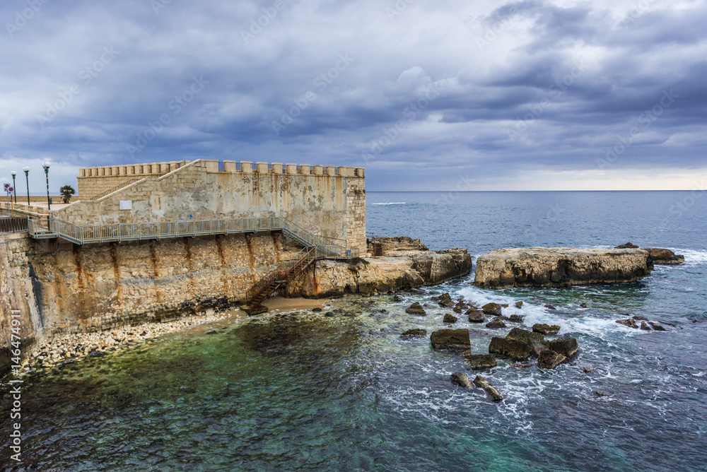 View on old walls of Ortygia isle, Syracuse city, Sicily Island in Italy