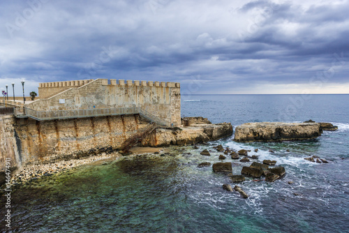 View on old walls of Ortygia isle, Syracuse city, Sicily Island in Italy