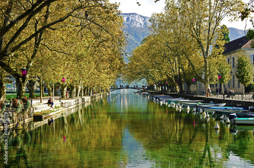beautiful Pont des Amours (Bridge of Love) in Annecy, with reflection in water