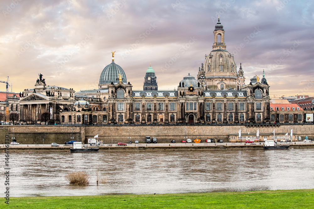 view of Academy of Fine Arts and Baroque church Frauenkirche cathedral with Elbe river in the foreground