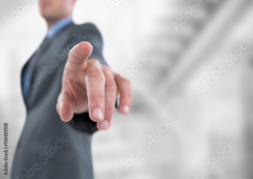 Midsection of businessman pointing