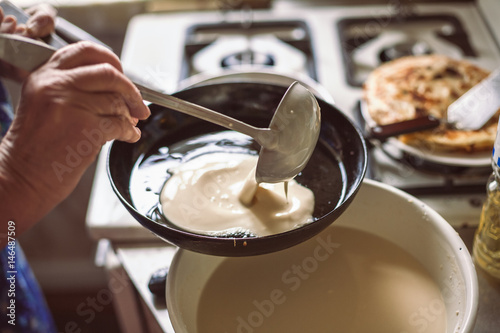 Grandmother making pancakes