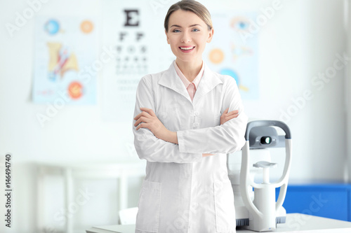 Female ophthalmologist with crossed arms in clinic