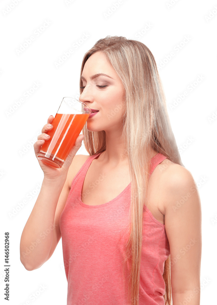 Beautiful young woman drinking fresh juice on white background Beautiful young woman drinking fresh juice on white background