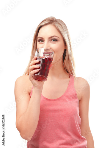 Beautiful young woman drink...