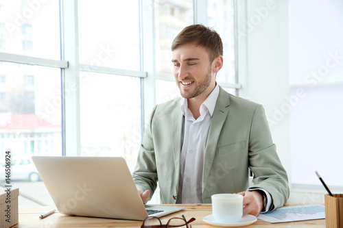 Handsome young man working ...