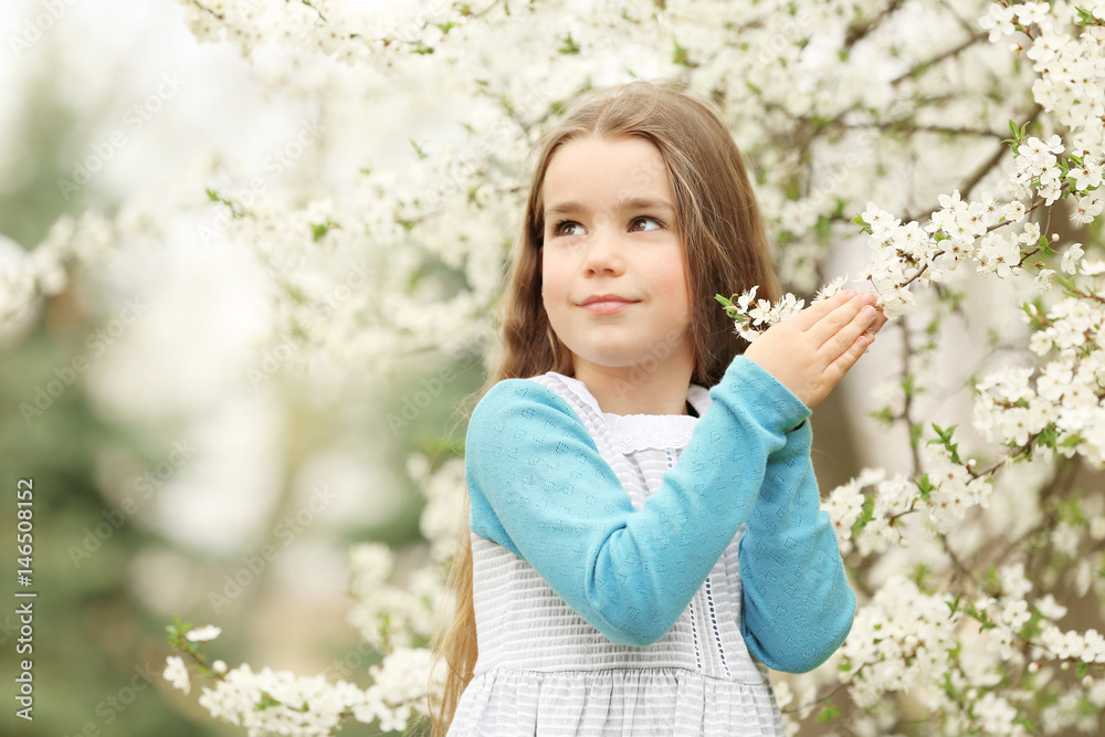 Cute little girl walking in spring park Cute little girl walking in spring park