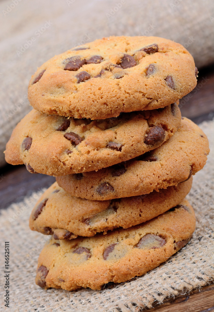 Stack of delicious cookies on table