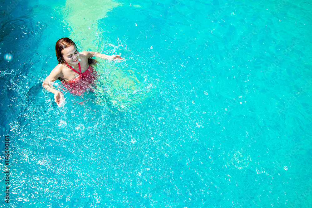 Asia Women swim in the pool