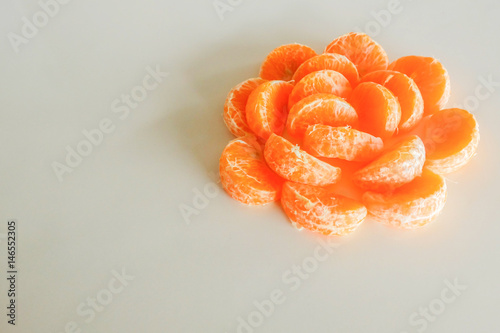 Slika na platnu The orange petals on table.