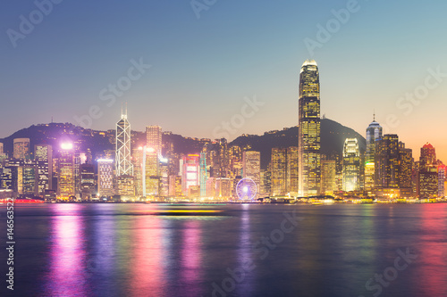 Cityscape and skyline at Victoria Harbour in Hong Kong city at twilight time.