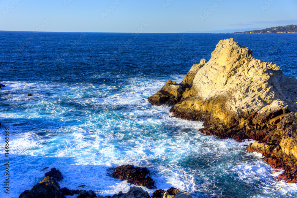 Pacific coast ocean rocks in Point Lobos after wave