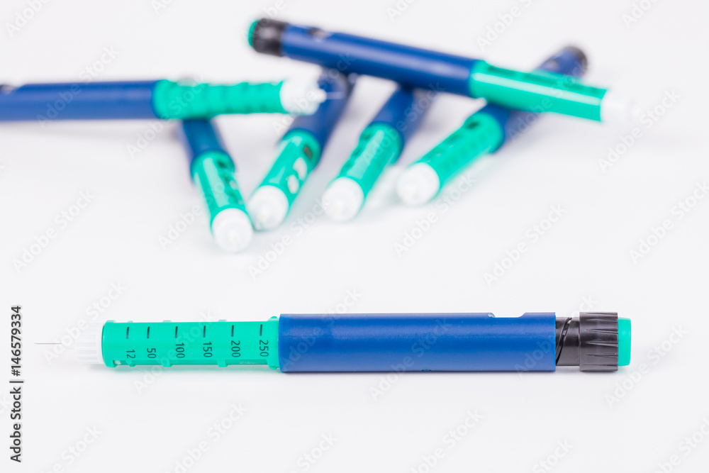insulin pen on white background