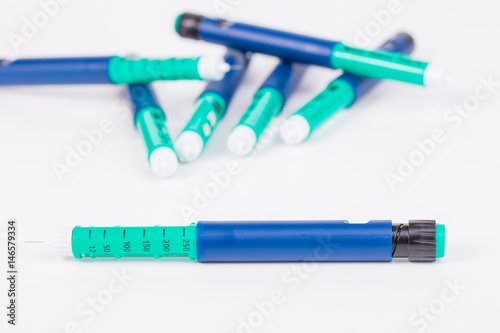 insulin pen on white background