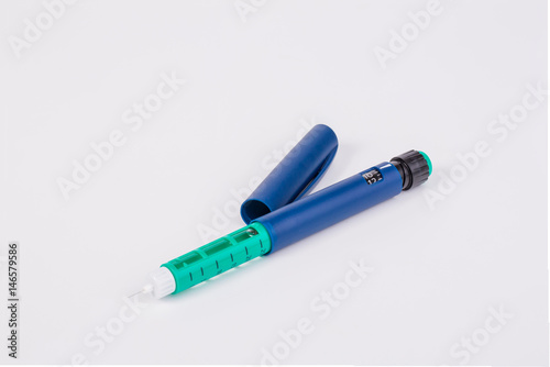 insulin pen on white background