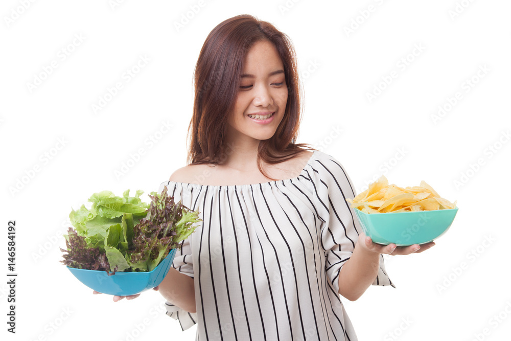 Young Asian woman with potato chips and salad. Young Asian woman with potato chips and salad.