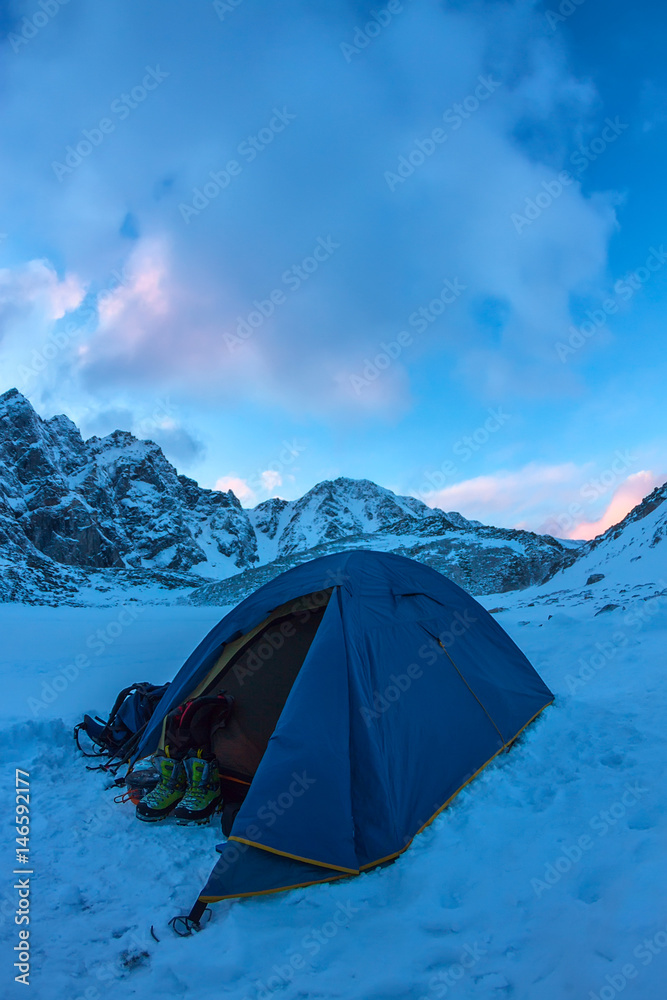 Blue tent in the base camp in the mountains Blue tent in the base camp in the mountains