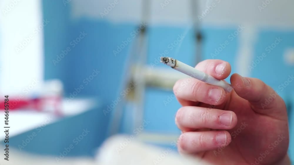 cigarette in man's hand cigarette in man's hand
