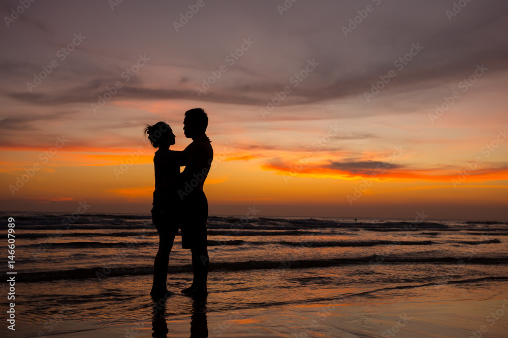 couple in love at sea sunset